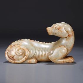 A HETIAN JADE DOG-SHAPED CARVING