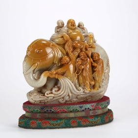 A SHOUSHAN STONE 'LUOHAN WASHING ELEPHANT' CARVING