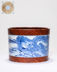 A WOOD-GLAZED BLUE AND WHITE 'LANDSCAPE AND FIGURES' BRUSHPOT