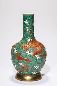 A GREEN-GROUND 'DRAGON IN WAVES' GLOBULAR VASE