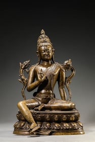 AN ALLOY COPPER SEATED GUANYIN INLAID WITH SILVER