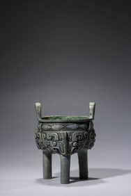 A BRONZE TRIPOD