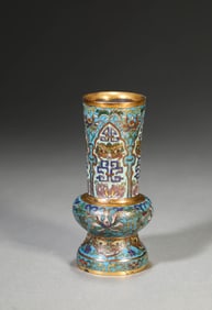 A CLOISONNé ENAMEL 'INTERLOCKING FLOWERS AND TAOTIE' BEAKER VASE