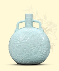 A PALE CELADON GLAZED CARVED 'DRAGON AND CLOUDS' MOONFLASK