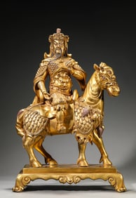 A GILT-BRONZE GUAN YU