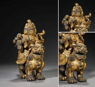 A GILT-BRONZE GUARDIAN KING