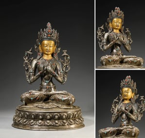 A TIBETAN SILVER MANJUSHRI