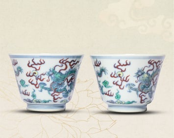 A PAIR OF DOUCAI 'DRAGON CHASING PEARL' CUPS