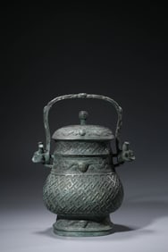 A BRONZE YOU WITH SWING HANDLE