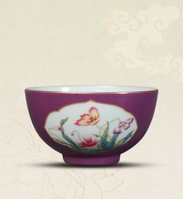 A PURPLE-GROUND FAMILLE-ROSE 'RESERVED PANEL FLORAL' BOWL