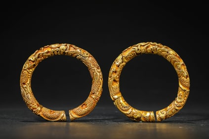 A PAIR OF GILT-BRONZE BRACELETS
