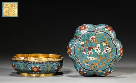 A CLOISONNé ENAMEL 'INTERLOCKING LOTUS WITH SHOU ' COVERED BOX