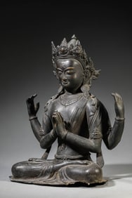 AN ALLOY COPPER FOUR-ARMED AVALOKITESHVARA