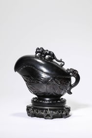 A WOOD CARVED 'DRAGON AND CHILDREN' GONG CUP