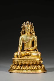 A GILT-BRONZE BUDDHIST FIGURE