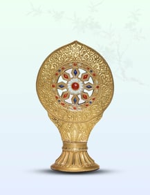 A GOLD-GLAZED DHARMA WHEEL
