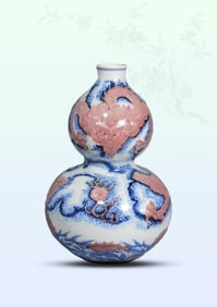 A BLUE AND WHITE AND UNDERGLAZE-RED 'DRAGON IN CLOUDS' GOURD SHAPED VASE