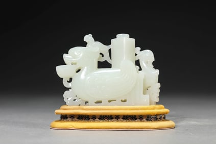 A JADE CARVED 'AUSPICIOUS BEAST' INCENSE HOLDER