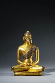 A TIBETAN TUBO-STYLE AMITABHA INLAID WITH SILVER