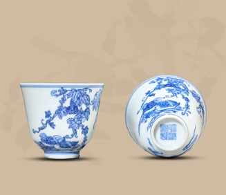 A PAIR OF BLUE AND WHITE 'FLOWERS, FRUITS AND MANDARIN DUCKS' CUPS