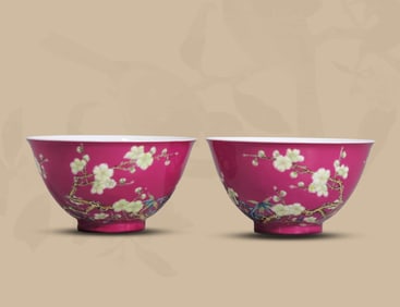 A PAIR OF RUBY RED-GROUND ENAMEL 'PLUM BLOSSOMS WITH INCISED BUTTERFLIES' TEA BOWLS