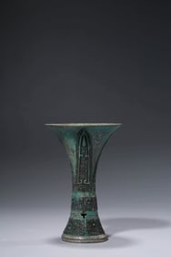 A BRONZE BEAKER VASE