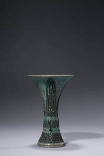 A BRONZE BEAKER VASE: A BRONZE BEAKER VASE Dimensions:Weight: 402g. Width: 9.8cm (3.86in) x Height: 14.9cm (5.87in). All measurements are approximate. Azaya Art Gallery is delighted to showcase our meticulously curated Asi