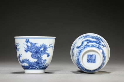 A PAIR OF BLUE AND WHITE 'DRAGON IN WAVES' CUPS
