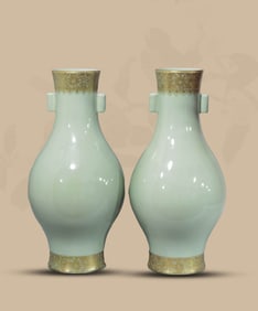 A PALE CELADON GLAZED AND GILT 'FLORAL' OLIVE-FORM VASE