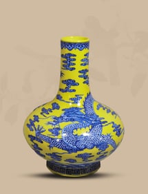 A BLUE AND WHITE AND YELLOW 'DRAGON IN WAVES' VASE