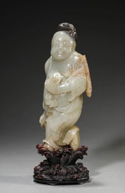A JADE CARVED 'LIU HAI PLAYING WITH TOAD'