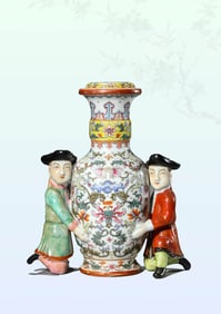 A FAMILLE-ROSE 'WESTERN FIGURES SUPPORTING FLOWERS' VASE