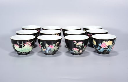 A SET OF ENAMEL 'FLOWER MONTH' CUPS