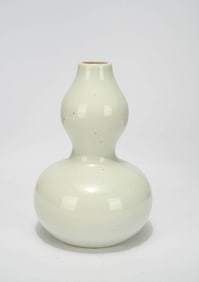 A WHITE-GLAZED GOURD SHAPED VASE