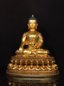 A NEPALESE GILT-COPPER TURQUOISE-INLAID SHAKYAMUNI STATUE
