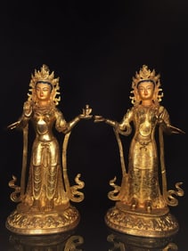 A PAIR OF NEPALESE GILT-COPPER STANDING TARA STATUES