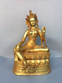 A GILT-COPPER GREEN TARA STATUE