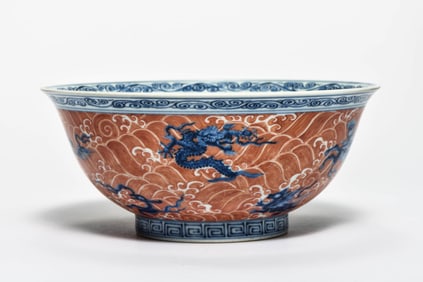 AN IRON-RED AND BLUE-AND-WHITE 'DRAGON' BOWL