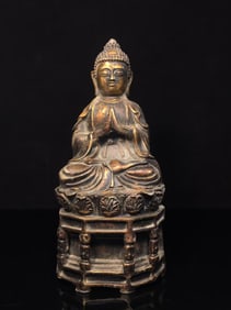 A FINELY CAST COPPER SHAKYAMUNI STATUE