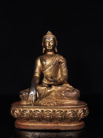A FINELY CAST COPPER SHAKYAMUNI STATUE