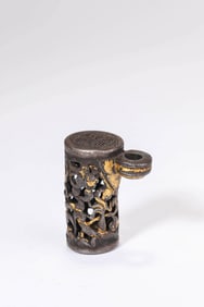 A TIBETAN IRON AND GOLD OPENWORK SEAL