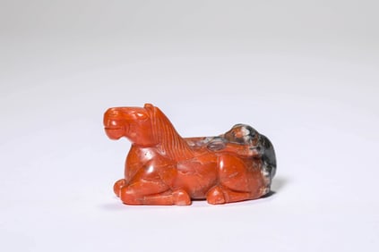 AN AGATE 'MANDARIN ON HORSEBACK' CARVING