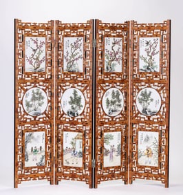 A WOODEN SCREEN WITH PORCELAIN PANELS