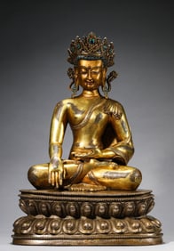 A GOLD-CROWNED FIGURE OF SHAKYAMUNI