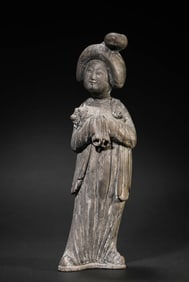 A WOODEN FIGURE