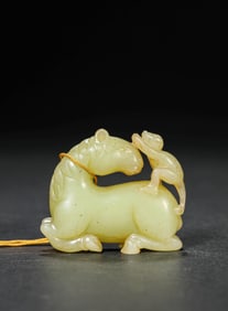 A JADE CARVING OF 'MANDARIN ON HORSEBACK'