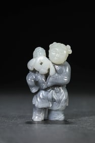 A JADE CARVING OF FIGURE