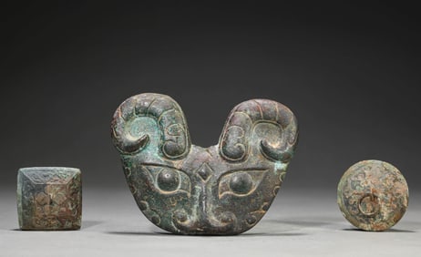A GROUP OF BRONZE OBJECTS