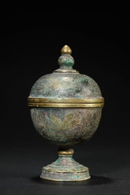 A PARTIALLY GILT BRONZE 'FLOWER-AND-BIRD' RITUAL CUP