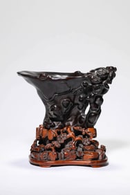 A WOODEN 'FLOWER-AND-BIRD' RHINOCEROS HORN CUP
